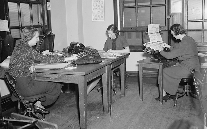 Clerks at the Reconstruction Finance Corporation computing interest on RFC loans, c. 1937