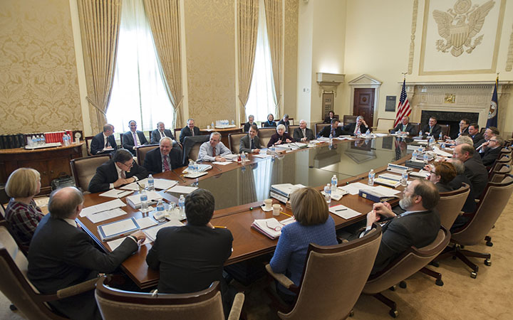 FOMC participants gather in the Board room at the Eccles Building in Washington, D.C., March 2014.