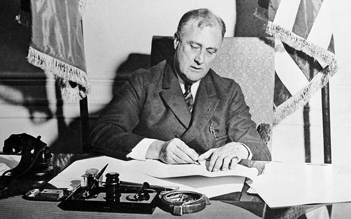 President Franklin&nbsp;Roosevelt signing the Emergency Banking Act