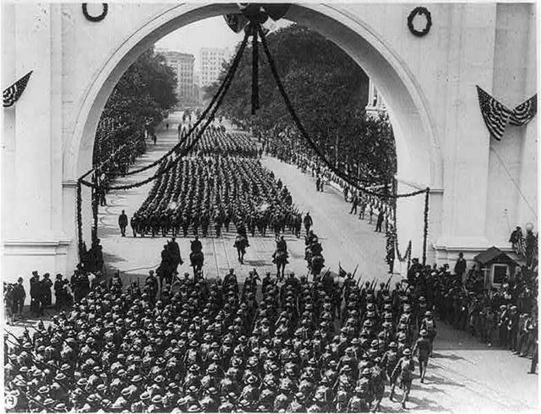 Soldiers returning from World War I parading through Victory Arch on Pennsylvania Avenue in Washington, D.C.