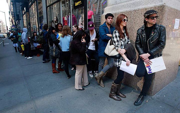 Job seekers line up to apply for positions at an American Apparel store April 2, 2009, in New York City.