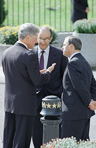 President Clinton talks to Federal Reserve Board Chairman Alan Greenspan and White House Senior Adviser Mack McLarty outside the Treasury Department before signing the Interstate Banking and Branching Efficiency Act.